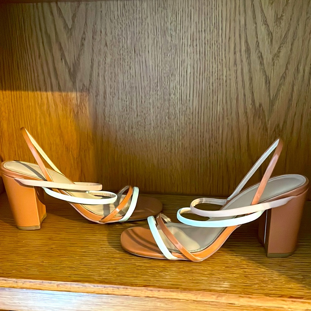 Cute brown and white strappy sandal heels. Perfect for summertime.